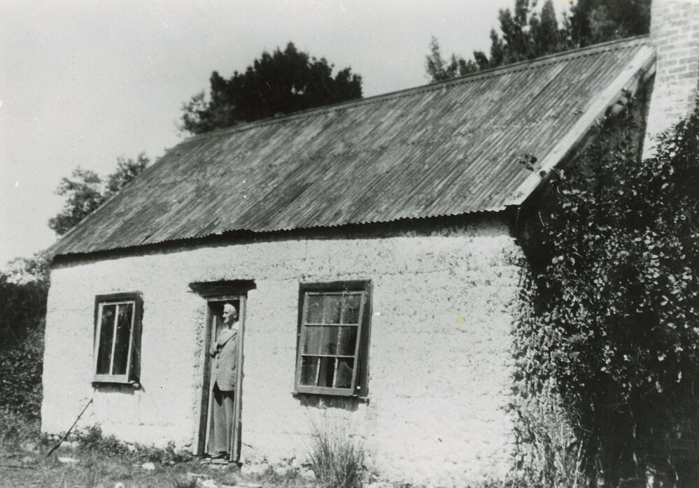 Charlie Boyce at the old cob cottage Mahana