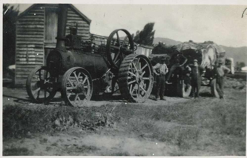 Traction engine, men and massive log