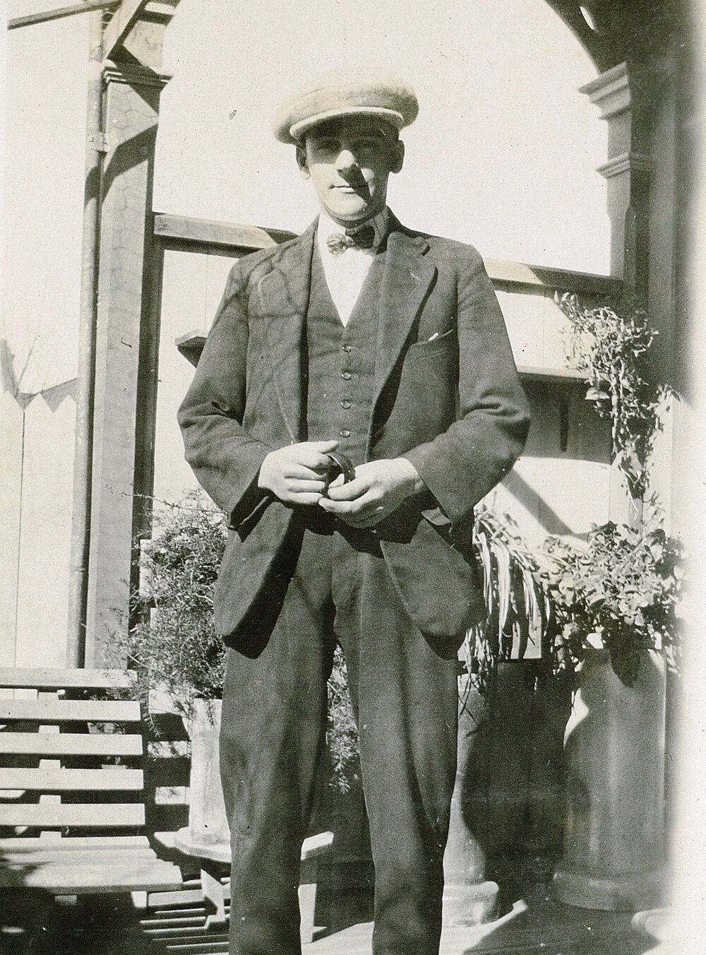 Frank wearing hat and bowtie