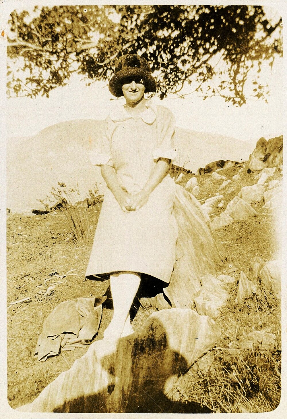 Grace Newport on rocks at Tākaka 1925