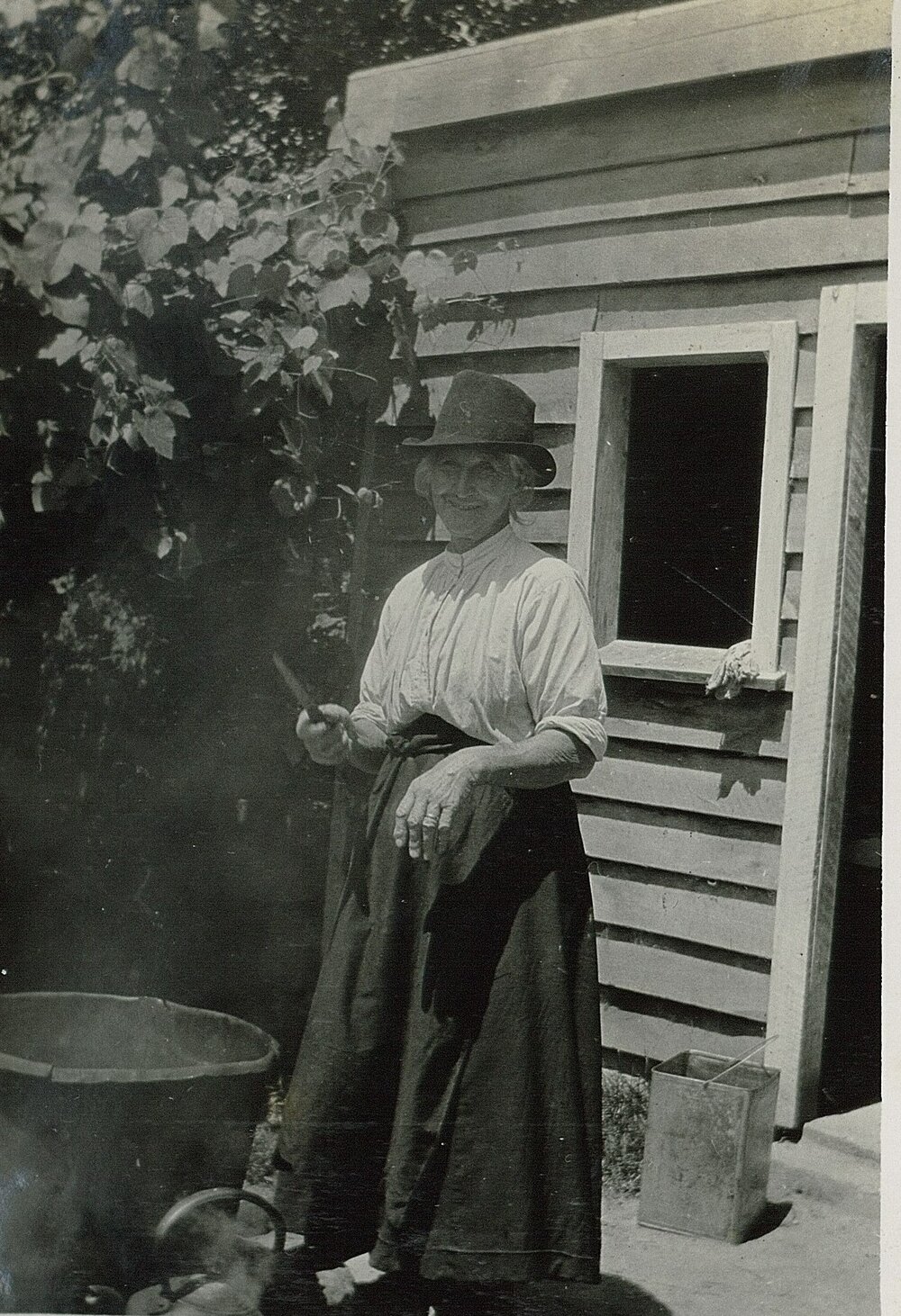 Mrs Robertson outside with large pot
