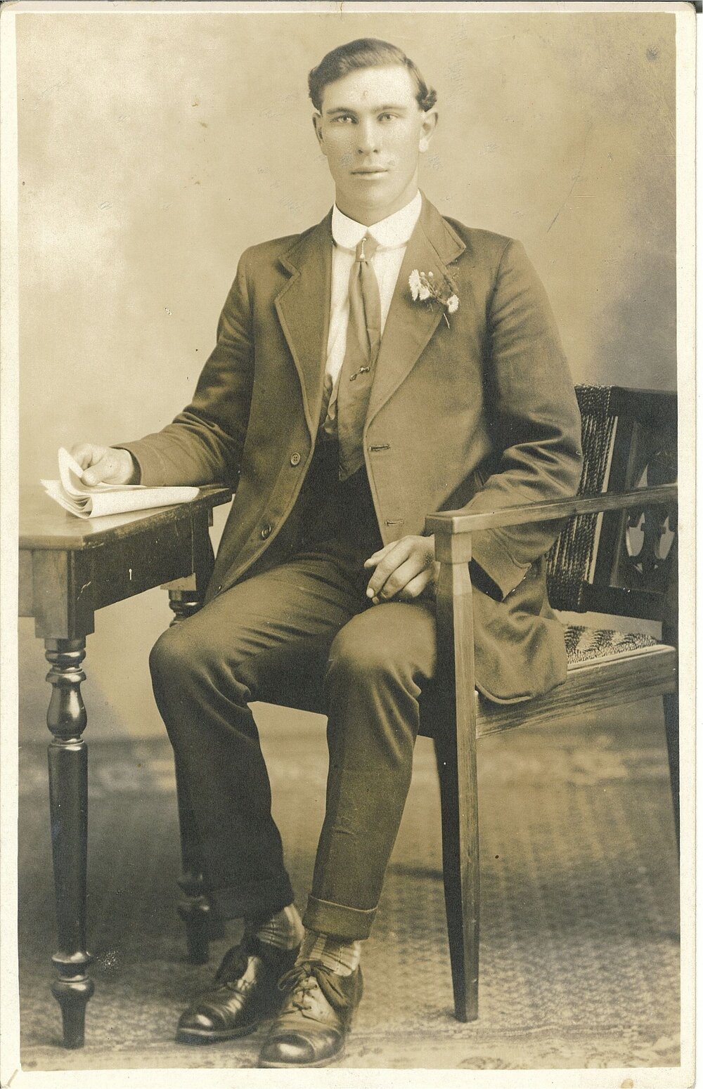 F N Jones photo of man sitting at a table
