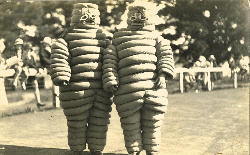 Two people in Michelin tyre man costumes
