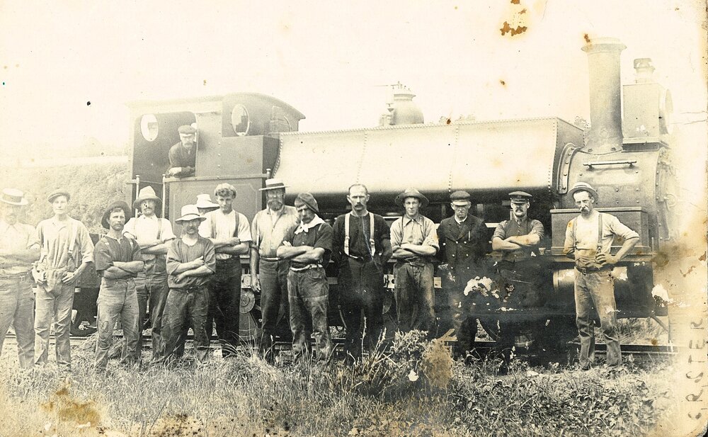 Postcard of train engine and railway staff 