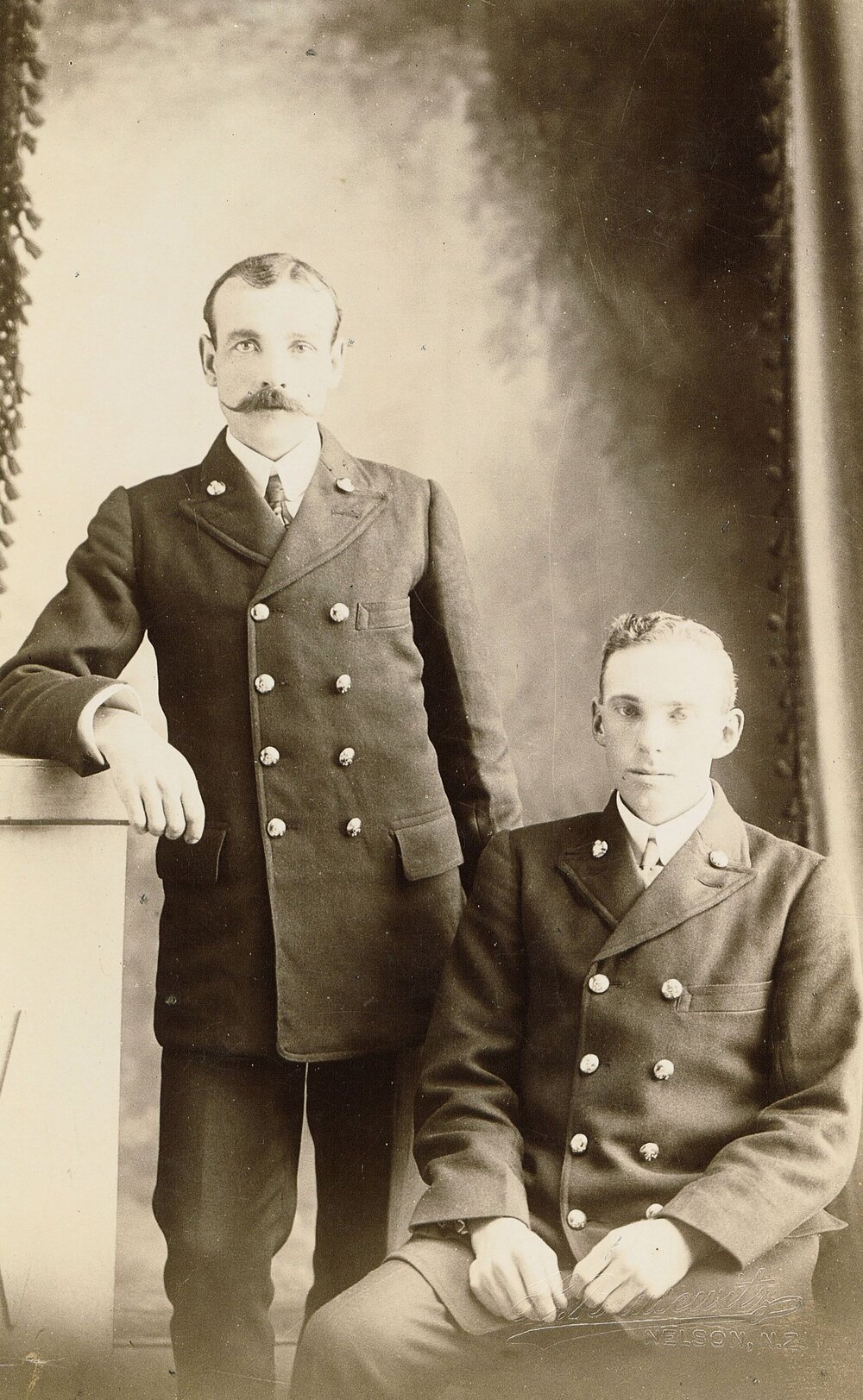 Two men in double breasted coats