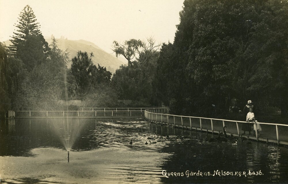 Family watching birds at the Queen's Gardens