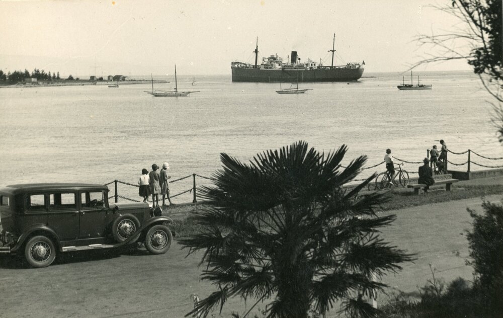Ship leaving the harbour through the channel