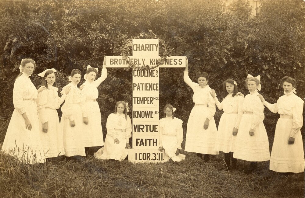 Religious postcard of girls surrounding a cross