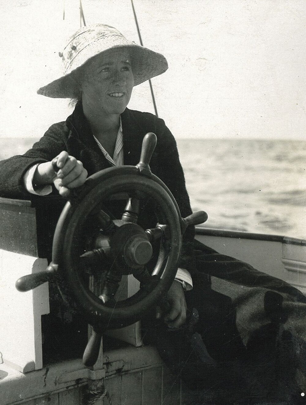 Young captain at ship's wheel