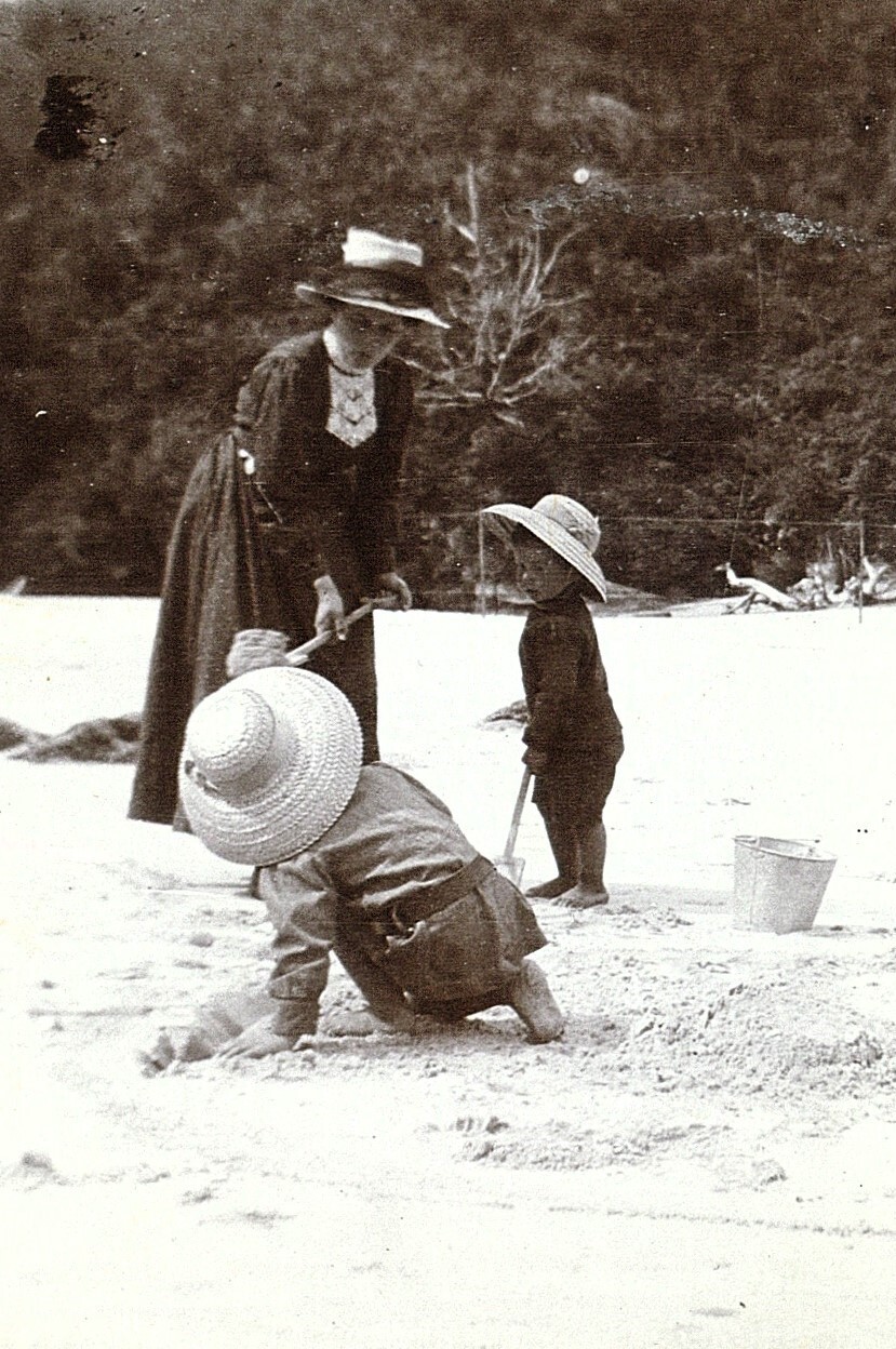 Family playing in the sand