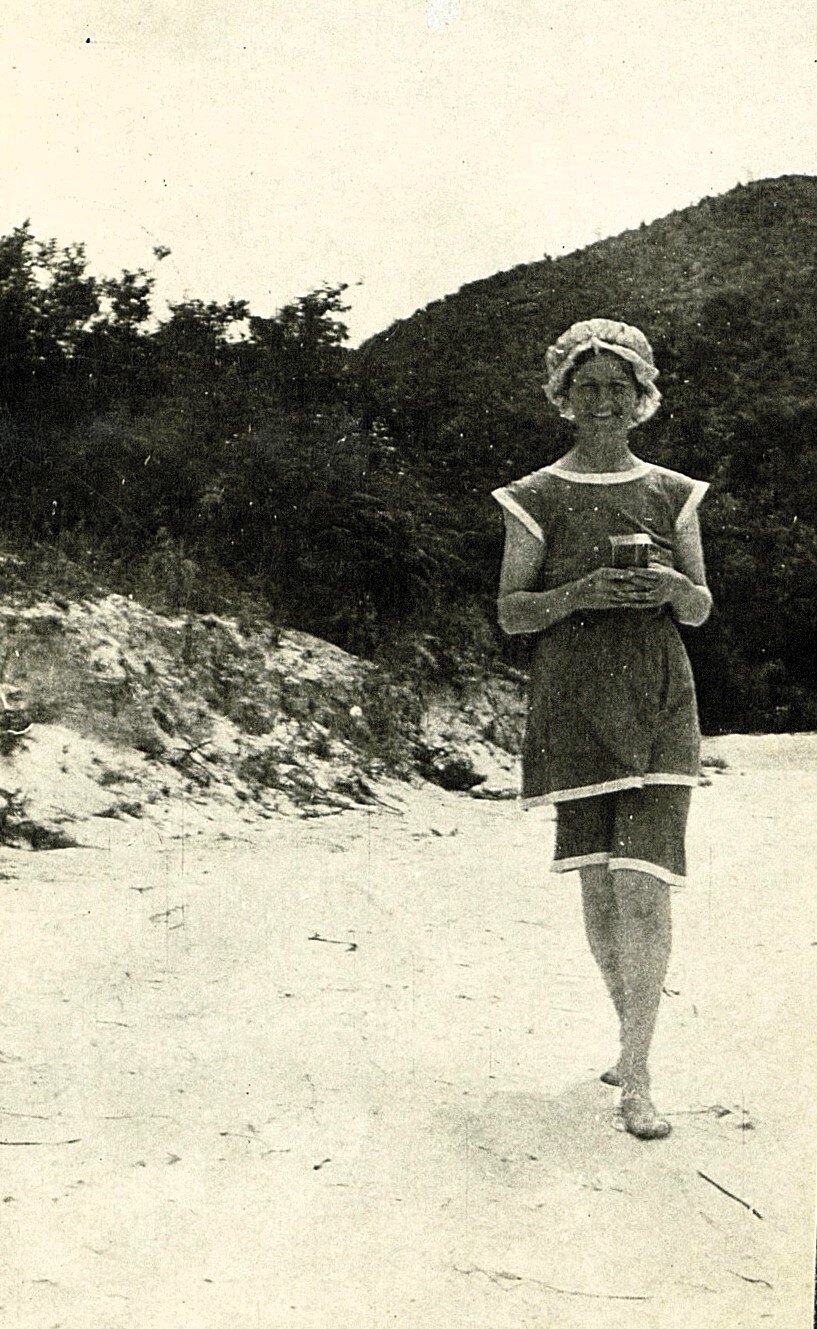 Woman in bathing suit and cap
