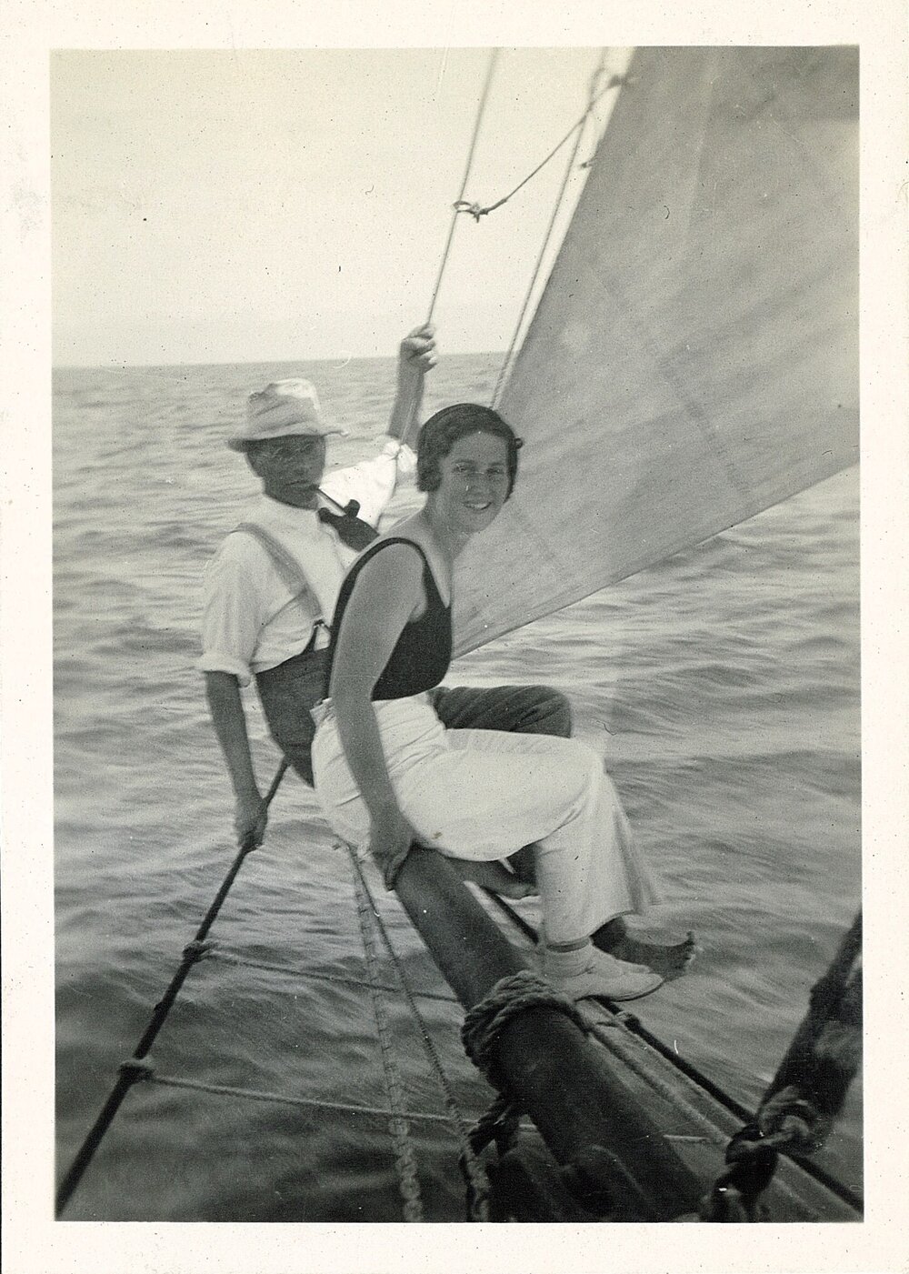 Pair balancing on yacht bowsprit