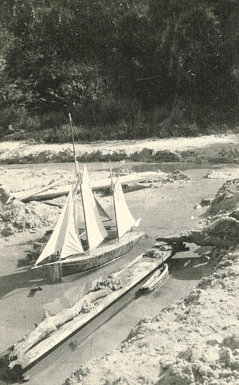 Model sailboat at the beach