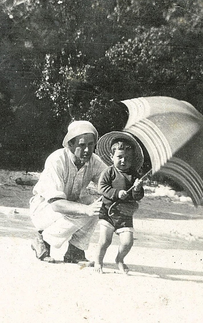 Adult with child and parasol
