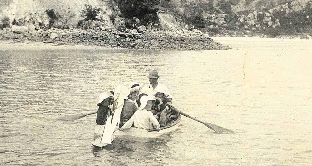 Rowboat overloaded with children