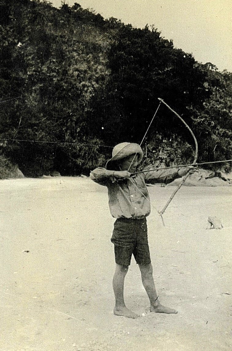 Boy with bow and arrow