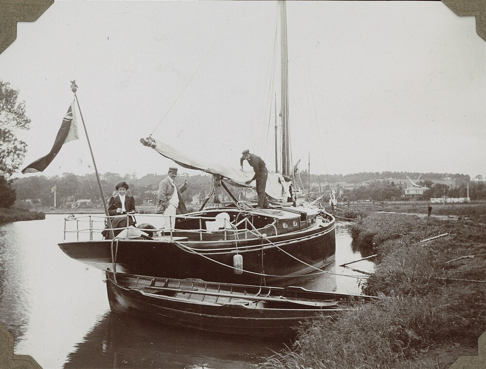 Three people on a canal boat