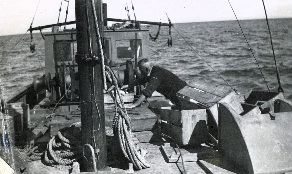 Man working on the deck of a fishing boat