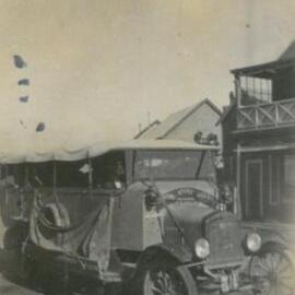 Early coach or charabanc on Queen Street
