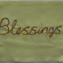 Embroidered quilt piece with the word blessings
