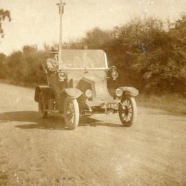 Men in Renault automobile 