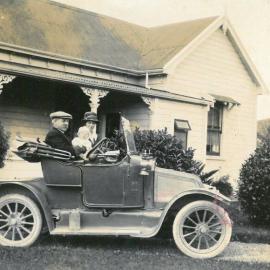 Family in car in driveway, Wakefield