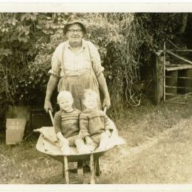 George Godbaz and wheelbarrow children