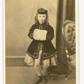 Young girl with matching hat and winter coat