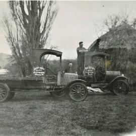 Two trucks, Haystack and two men