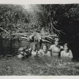Pickers cool off in the river 1931
