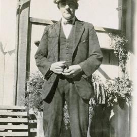 Frank wearing hat and bowtie