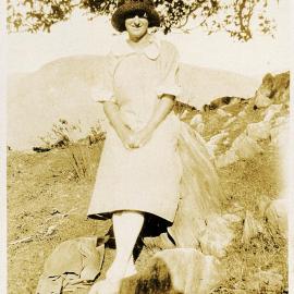 Grace Newport on rocks at Tākaka 1925