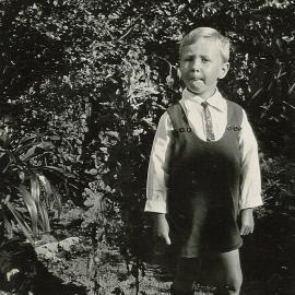 Little Ian in tie and romper suit 