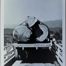 Logs being driven over Perseverence Bridge
