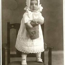 F N Jones photo of toddler with toy bucket