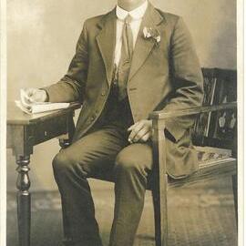 F N Jones photo of man sitting at a table