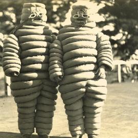 Two people in Michelin tyre man costumes