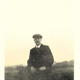 Man with flat cap outdoors