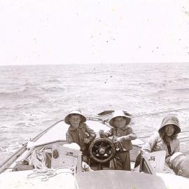 Children steering a yacht