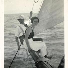 Pair balancing on yacht bowsprit