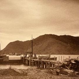 Ship alongside rustic wharf