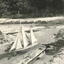 Model sailboat at the beach