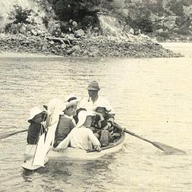 Rowboat overloaded with children