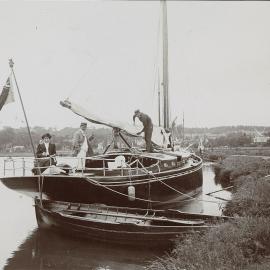 Three people on a canal boat