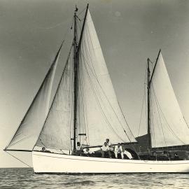 Seven men on a large sailboat