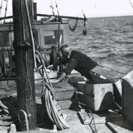 Man working on the deck of a fishing boat