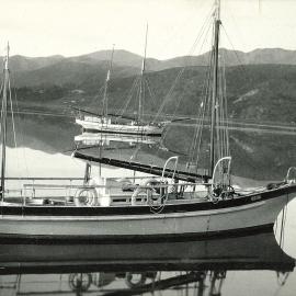 Two boats mirrored in the water